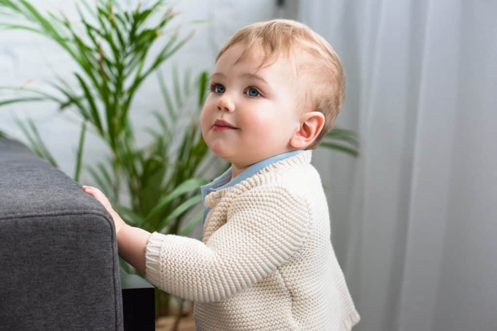 8 month old standing on tiptoes