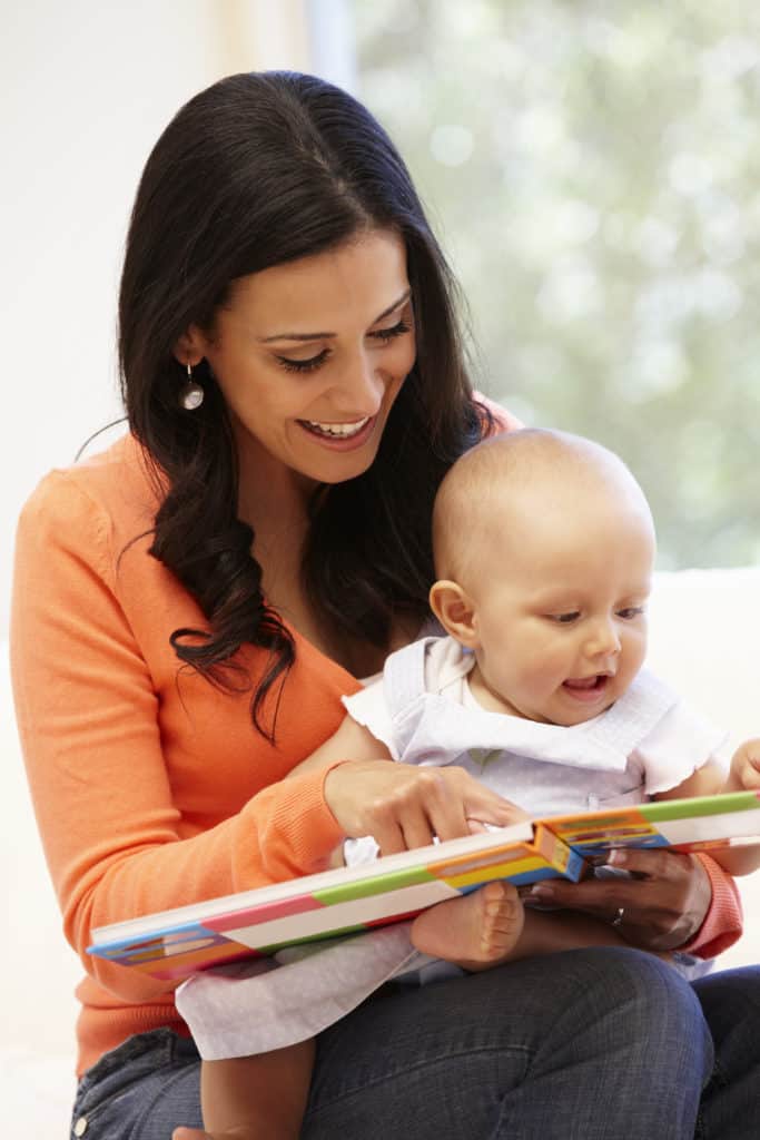 Mother reading to baby