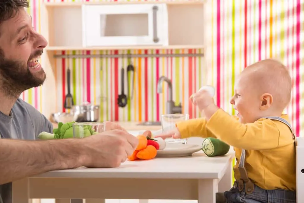 Baby playing with dad