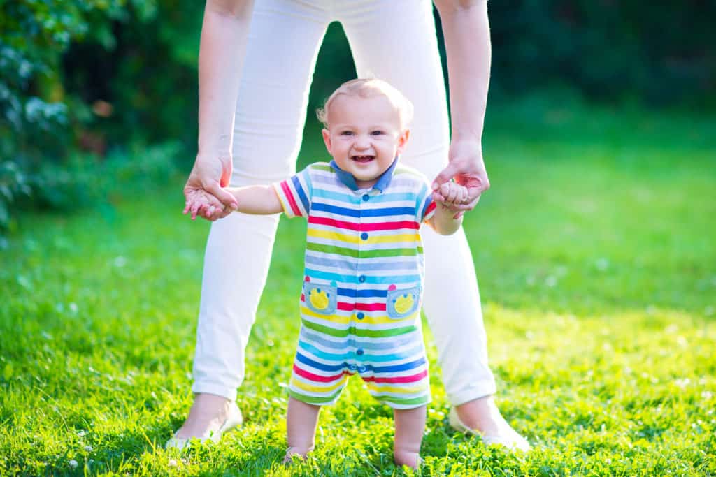 When do babies stand?