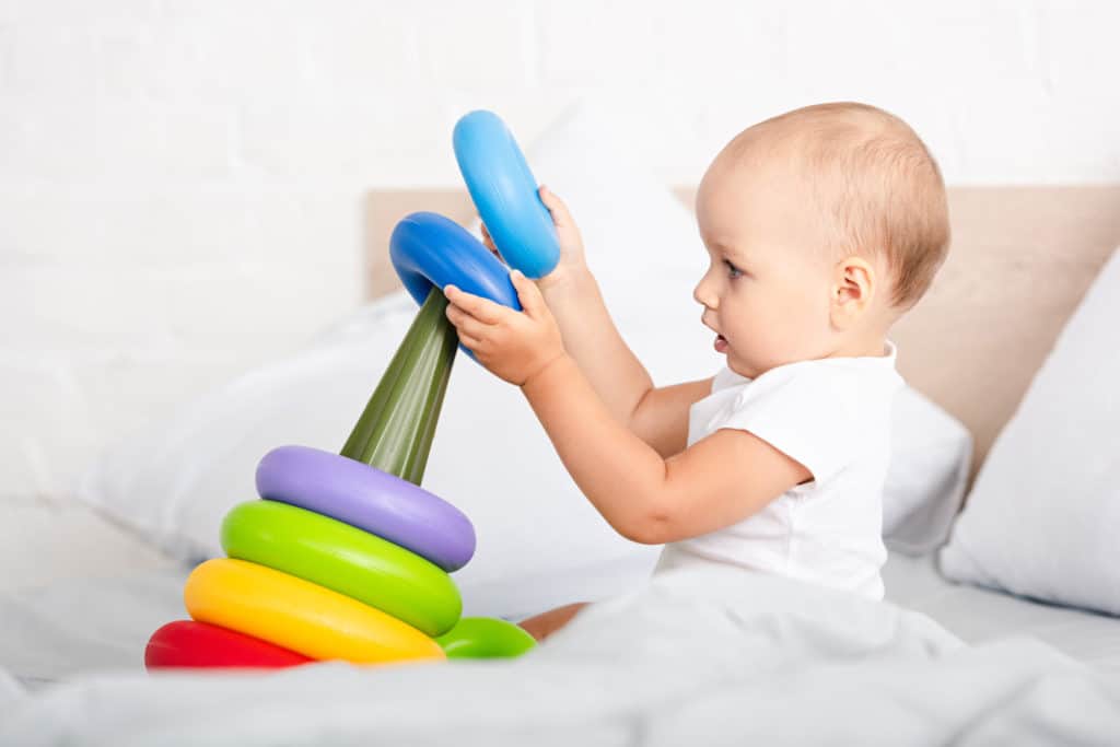 baby playing with toy