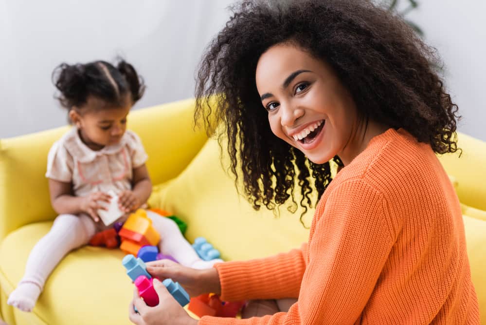 mom and toddler playing with blocks