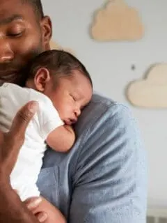 Father holding newborn baby