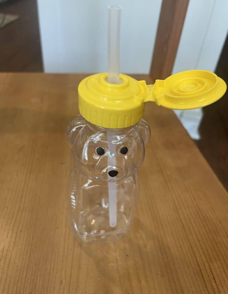 picture of honey bear cup with yellow lid and straw