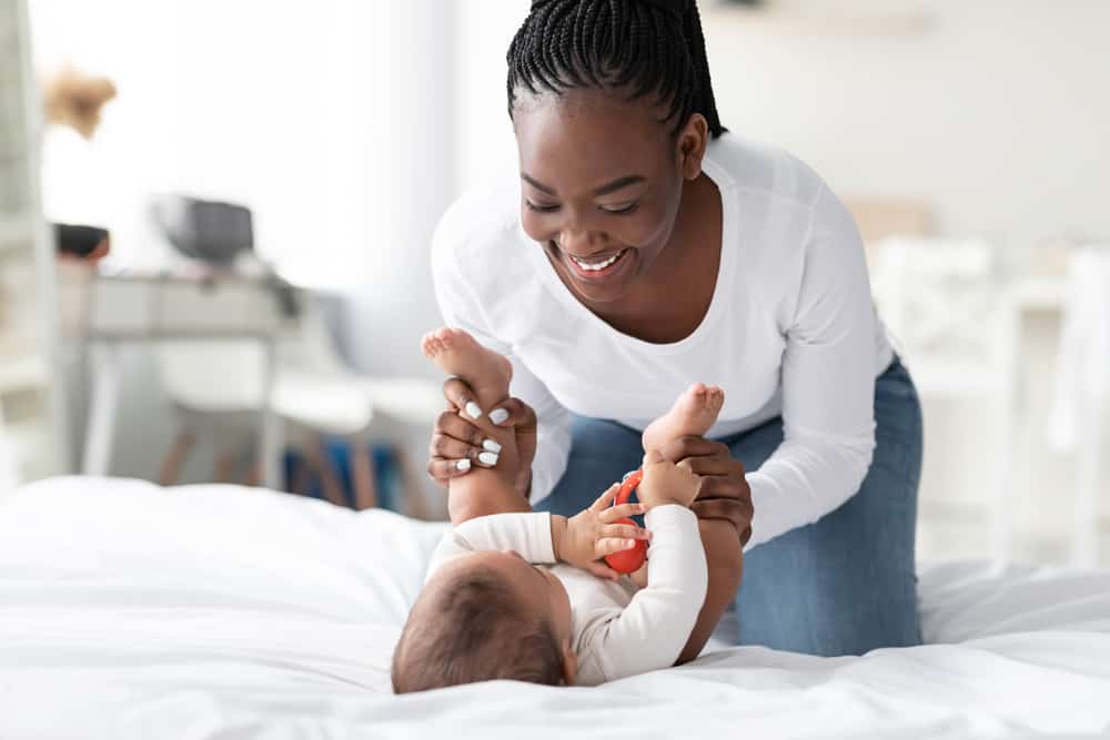 mom doing diaper change