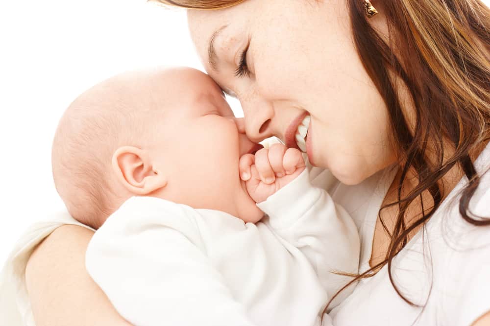 mom snuggling baby