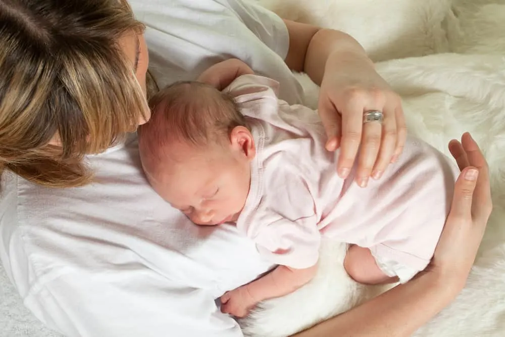 newborn doing tummy time on mom