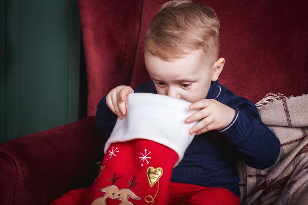 toddler looking in stocking