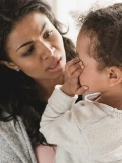 mom comforting toddler