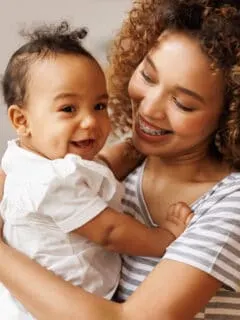 mom holding baby