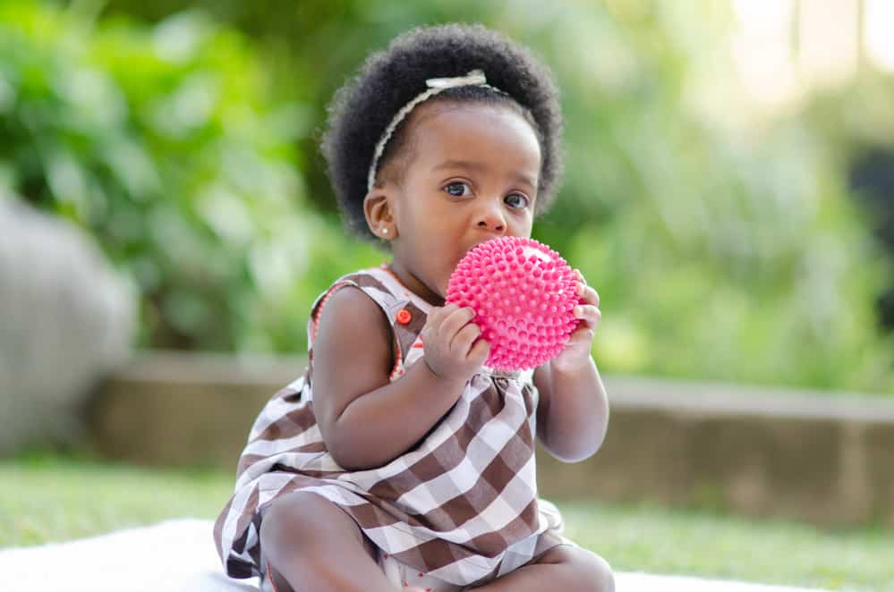 baby playing with a sensory ball